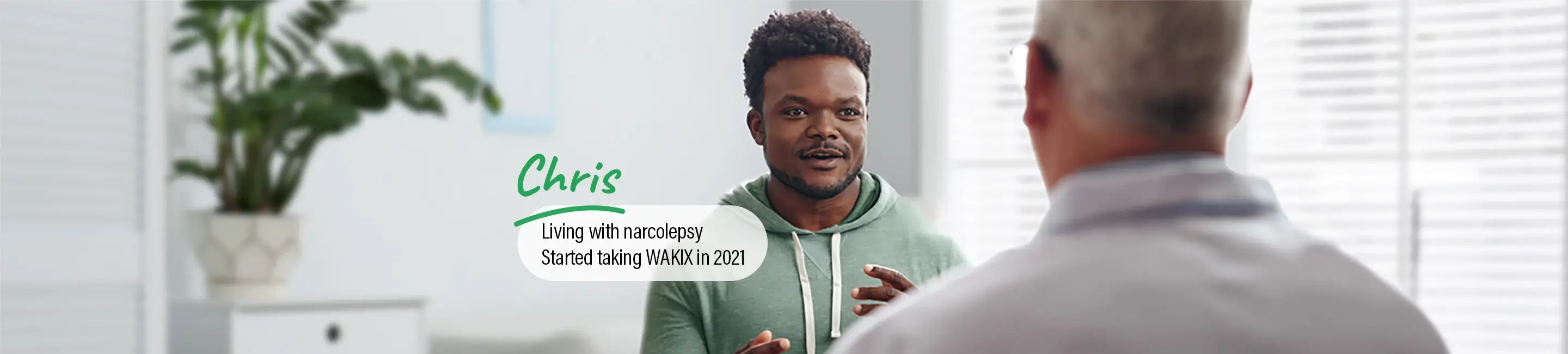 Chris, a real person living with narcolepsy taking WAKIX, talking with his doctor