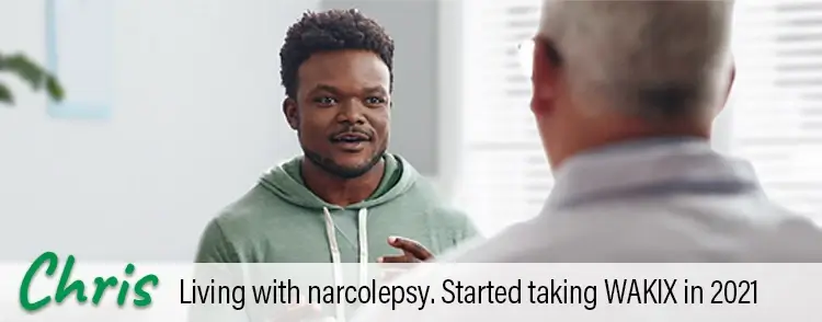 Chris, a real person living with narcolepsy taking WAKIX, talking with his doctor