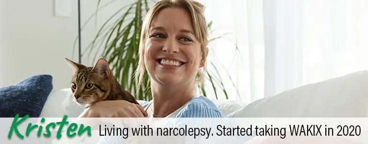 Kristen, a real person living with narcolepsy taking WAKIX, holding her cat